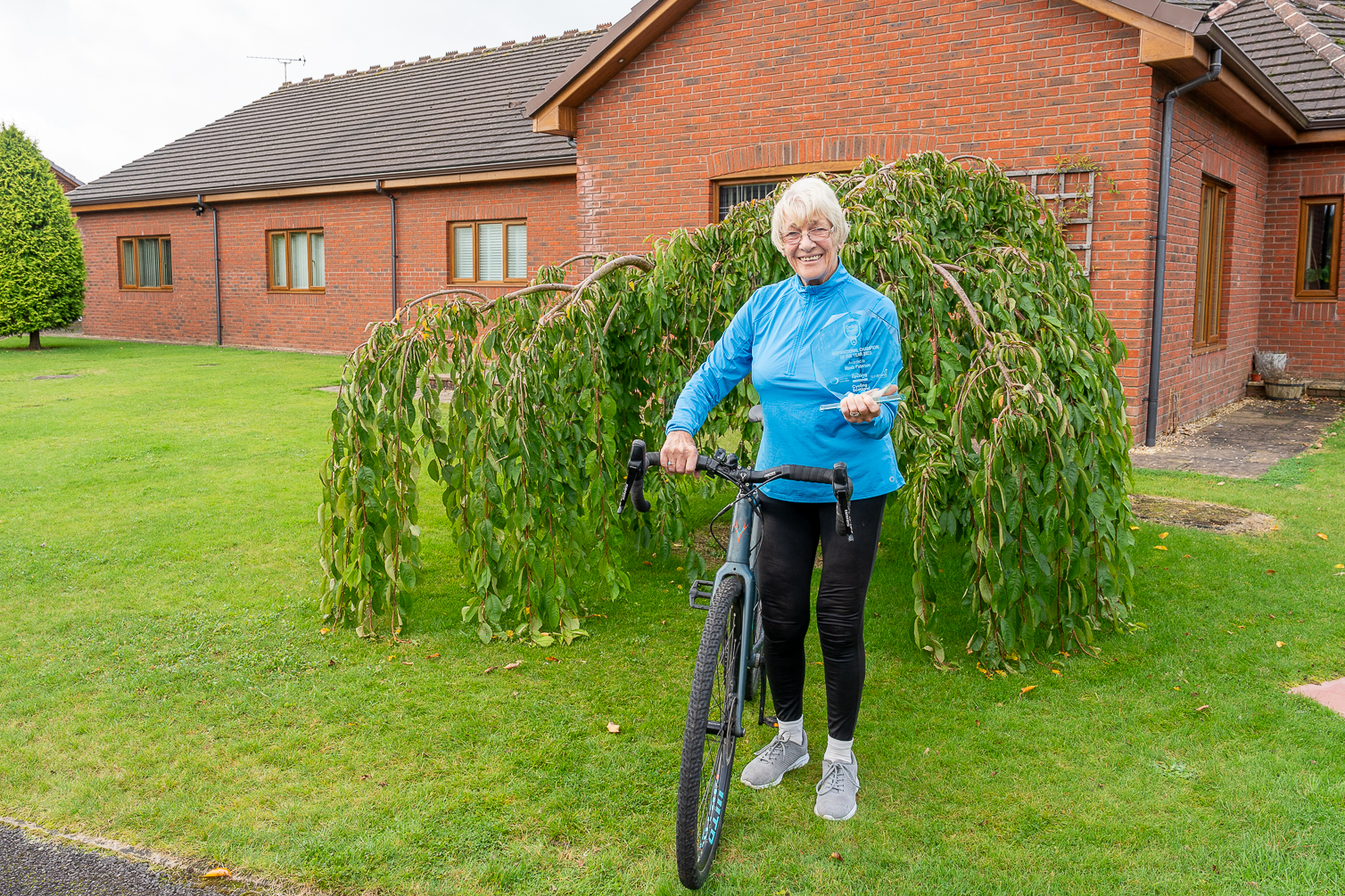 Woman in garden with bike